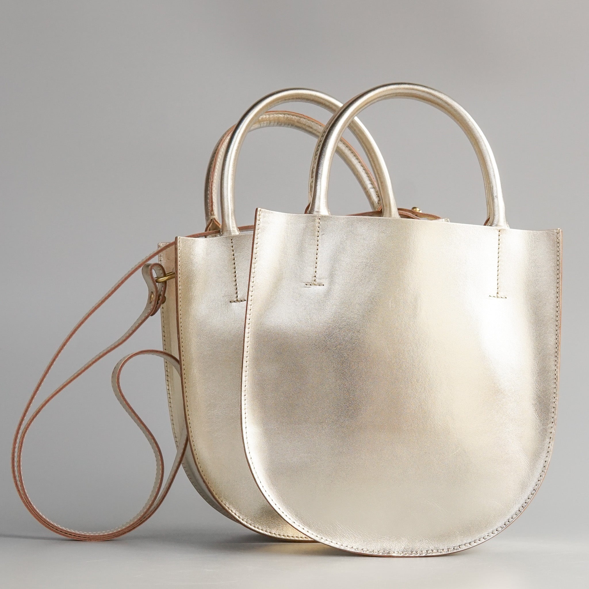 Minor History: The Convertible Champagne Arc Bag