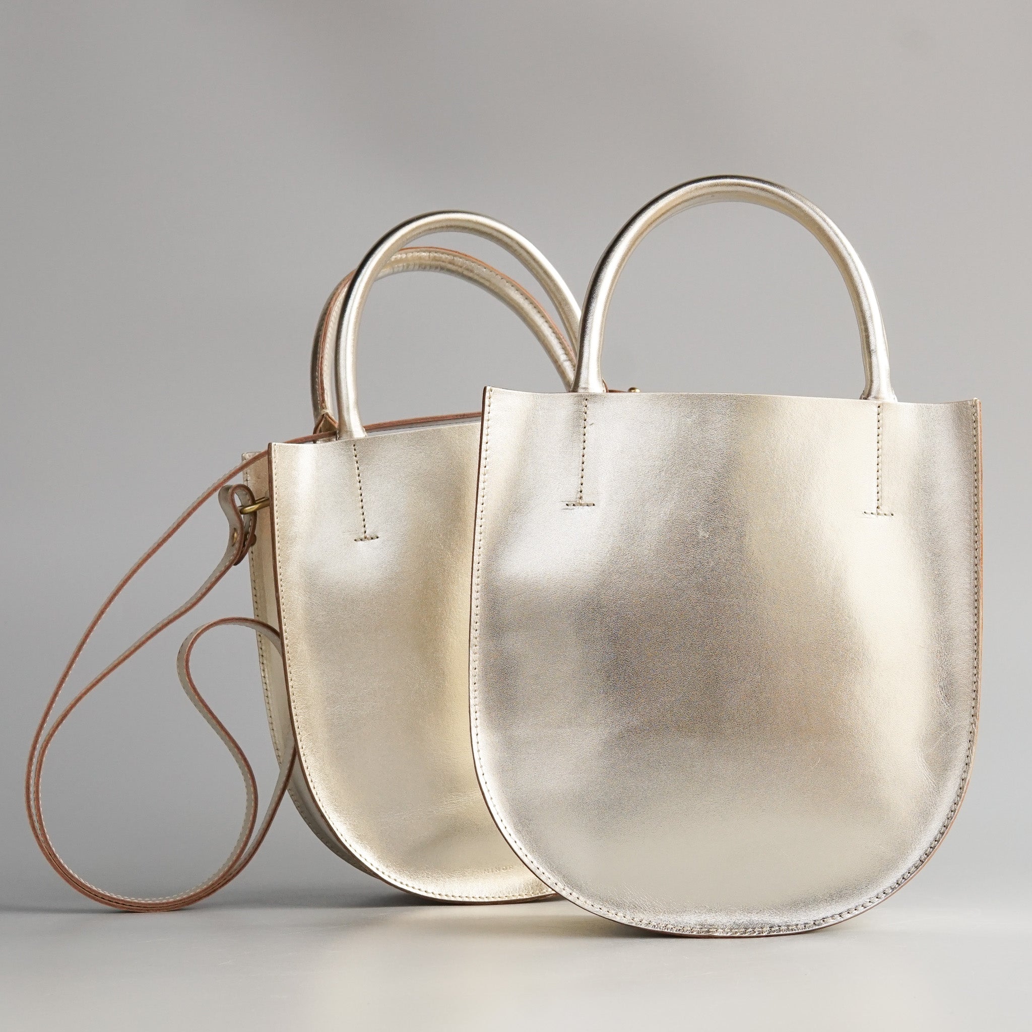 Minor History: The Convertible Champagne Arc Bag